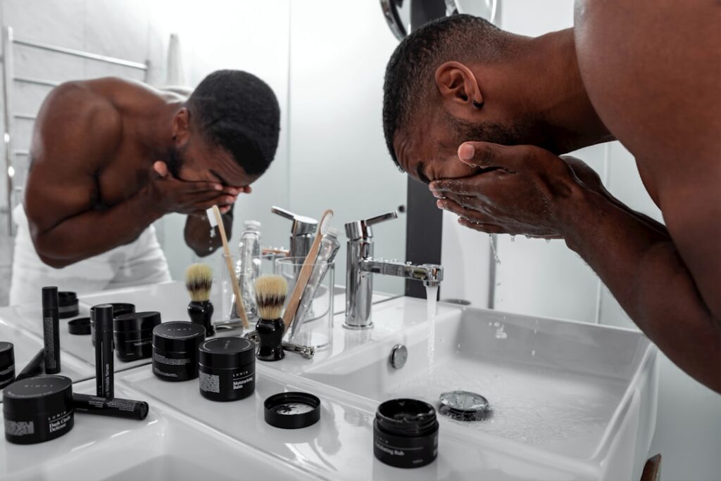 Man at a bathroom sink during a careful morning shave